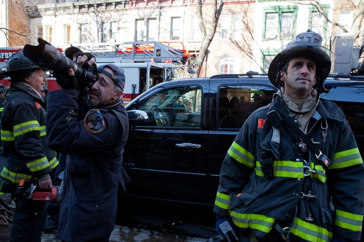 Todd Maisel shooting photos at a fire in Bedford-Stuyvesant. 